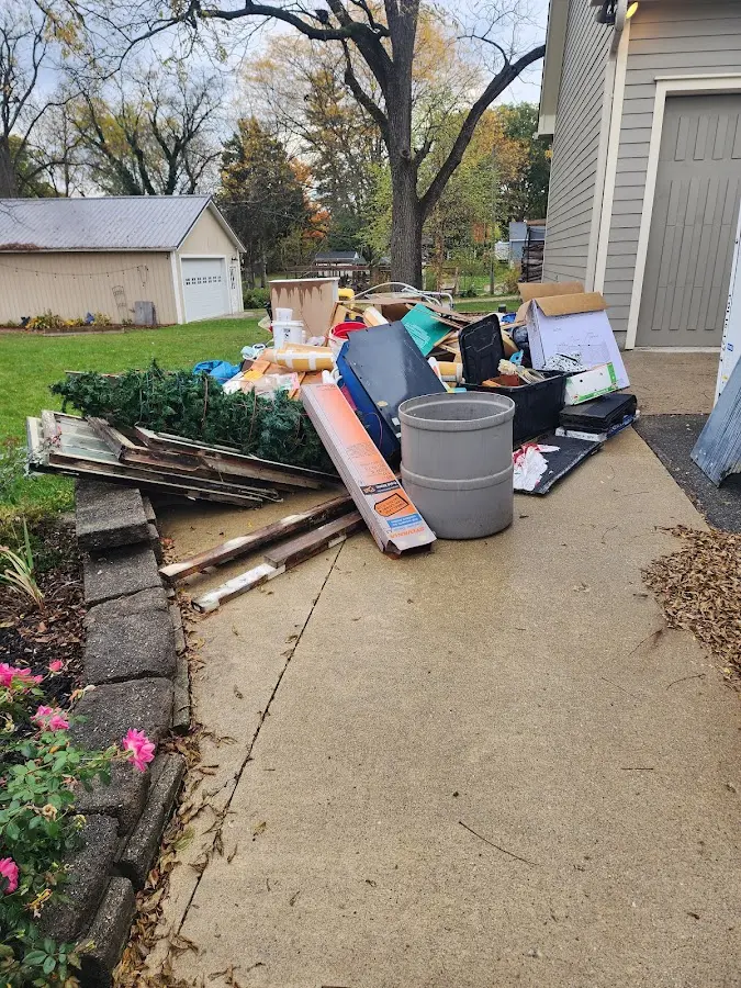 Dumpster being loaded with debris for 3 Yard Dumpster Rental in Zionsville